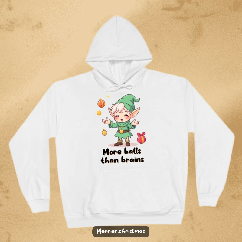Funny hoodie with a happy elf character intensely juggling shiny Christmas ornaments, looking absolutely thrilled with the festive chaos.