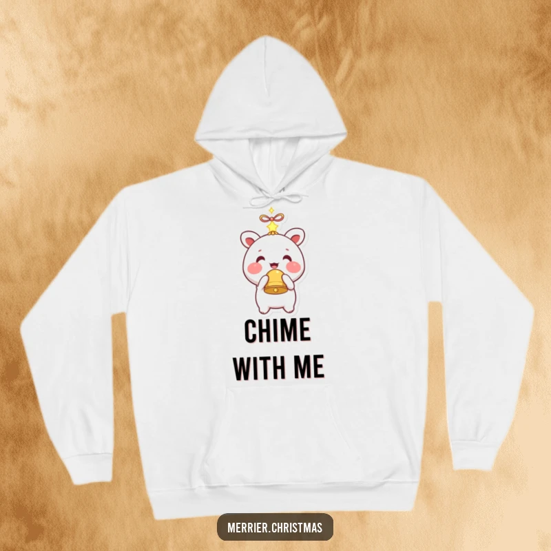 Funny hoodie graphic of a kawaii character with rosy cheeks holding a sparkling bell, offering cozy charm.