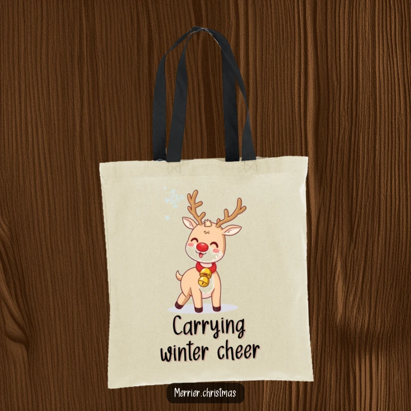 Funny Jingle Bell Reindeer Tote Bag: a cute reindeer humorously tossing a snowflake, wearing a jingle bell collar, for holiday shopping.